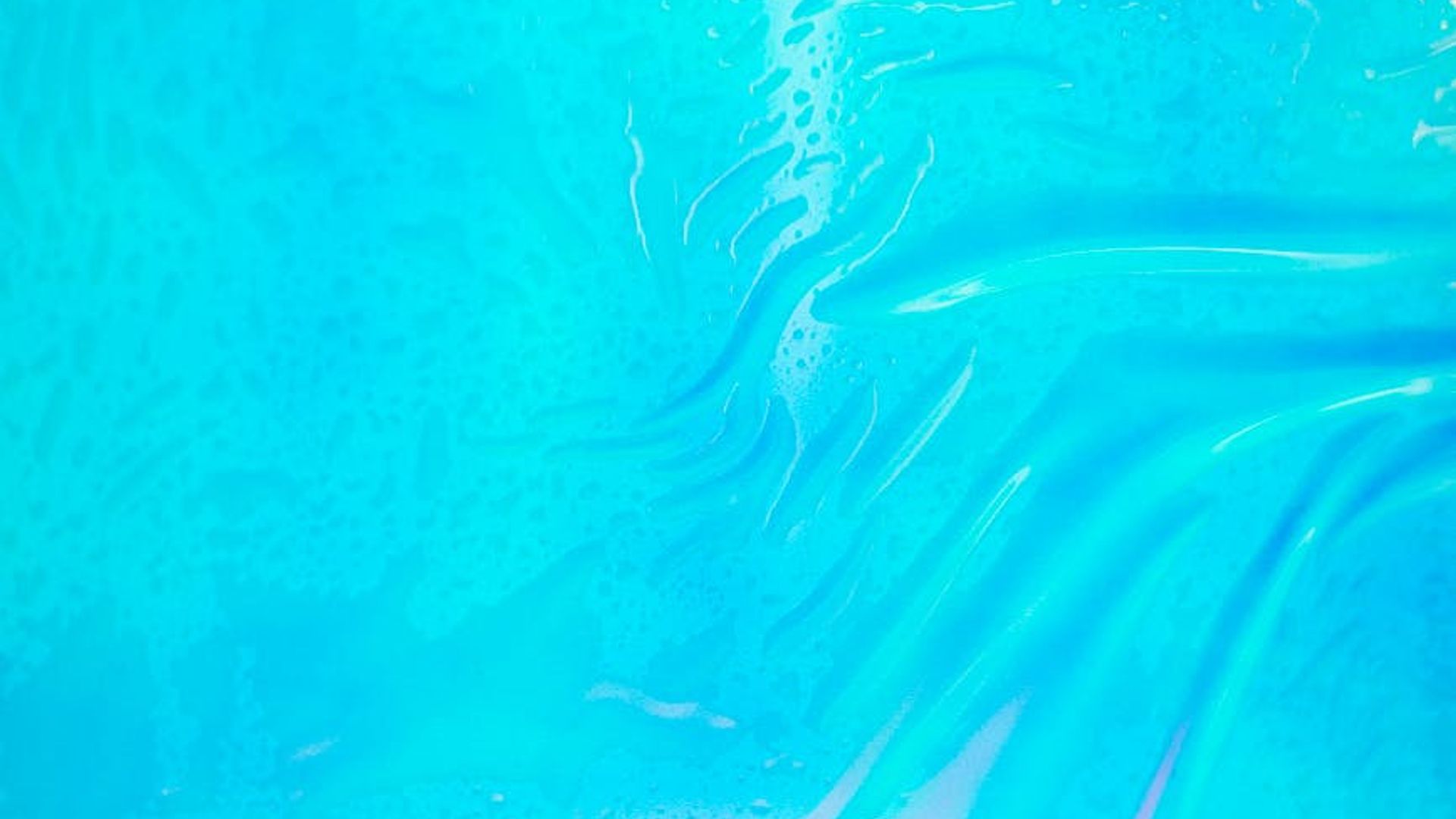 Abstract background with soft teal and cyan light waves.